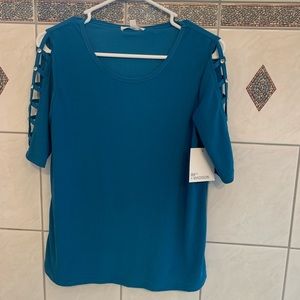 Teal/blue shirt sleeve shirt.